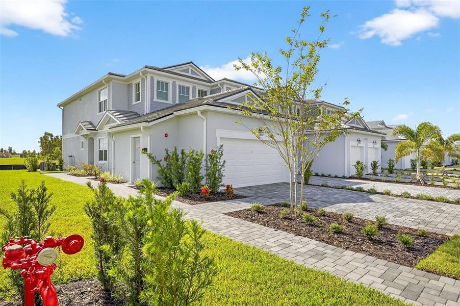 Front exterior of a new home in Wellen Park, Venice, FL, highlighting curb appeal (Image 2).