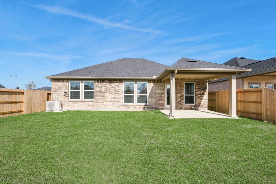 Exterior details and patio area of a home in Laurel Landing: Landmark Collection, Alvin (Image 3). Exterior details and patio area of a home in Laurel Landing: Landmark Collection, Alvin (Image 3).