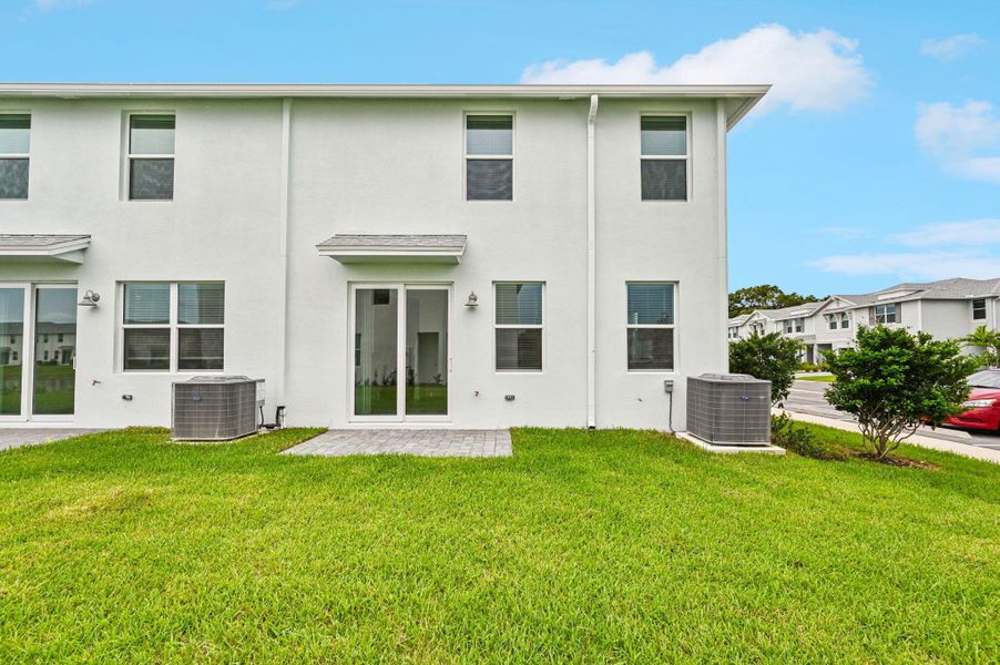 Front exterior of a new home in Tidewater, Fort Pierce, FL, highlighting curb appeal (Image 2). Front exterior of a new home in Tidewater, Fort Pierce, FL, highlighting curb appeal (Image 2).