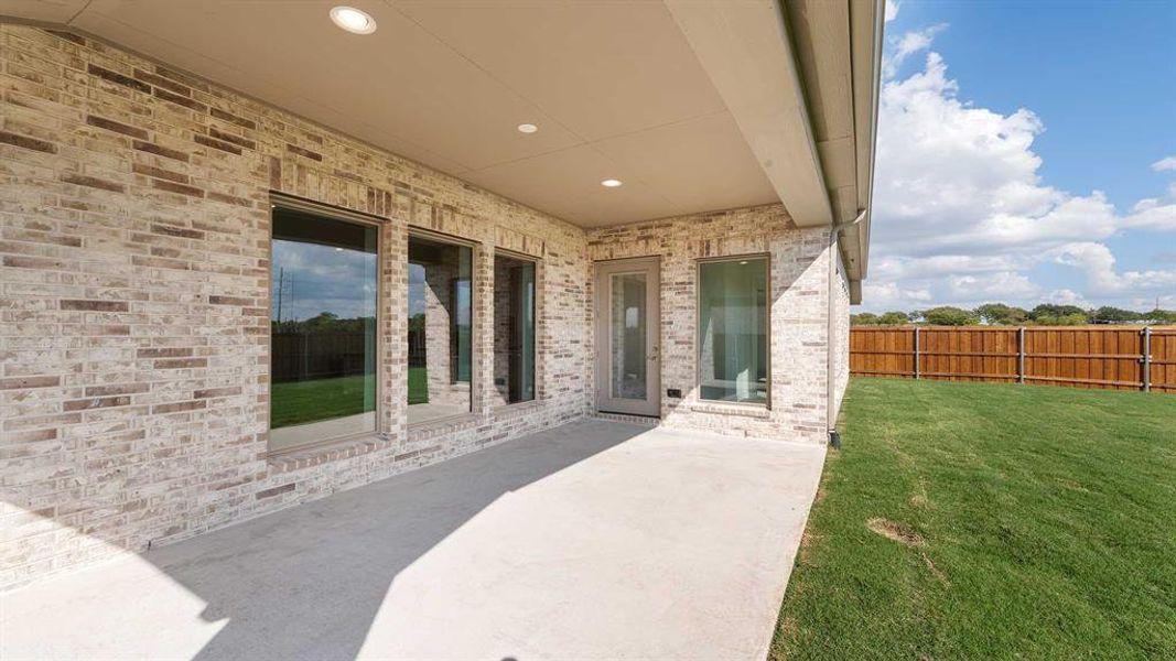 Exterior details and patio area of a home in Terraces 62', Rockwall (Image 3). Exterior details and patio area of a home in Terraces 62', Rockwall (Image 3).