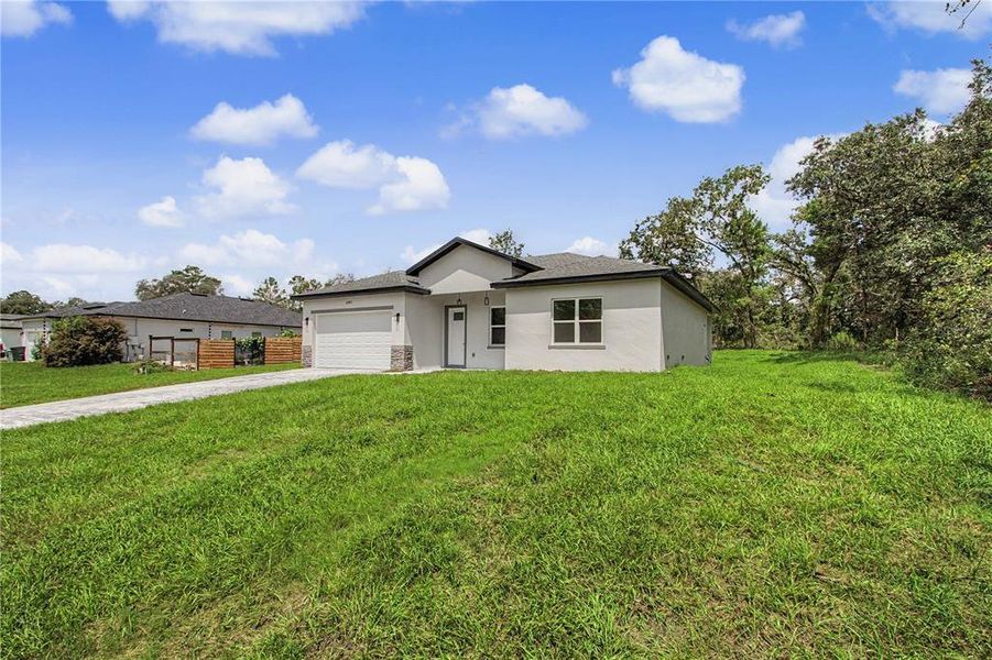 Front exterior of a new home in , Ocala, FL, highlighting curb appeal (Image 26).
