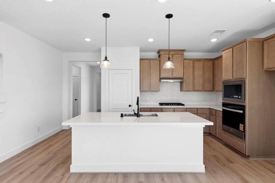 The kitchen is finished with modern cabinetry, durable yet stylish countertops, and stainless steel appliances, delivering a clean, cohesive look buyers love. The kitchen is finished with modern cabinetry, durable yet stylish countertops, and stainless steel appliances, delivering a clean, cohesive look buyers love.