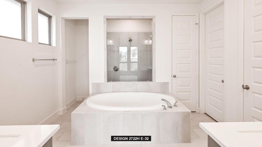 Full bathroom with vanity, a garden tub, an enclosed shower, and a closet