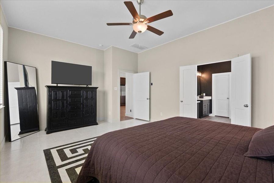 Tucked away from the main living areas off the kitchen and dining space, the oversized primary suite offers a private retreat with plenty of peace and separation from the rest of the home. Tucked away from the main living areas off the kitchen and dining space, the oversized primary suite offers a private retreat with plenty of peace and separation from the rest of the home.