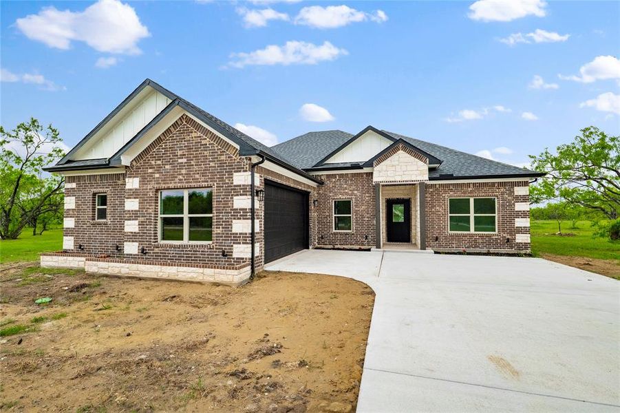 Front exterior of a new home in , Corsicana, TX, highlighting curb appeal (Image 21). Front exterior of a new home in , Corsicana, TX, highlighting curb appeal (Image 21).