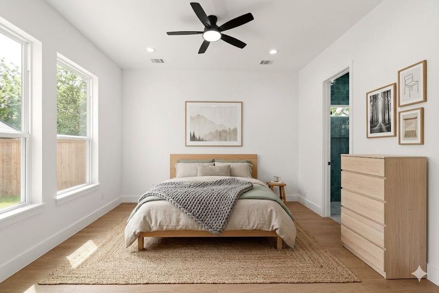 Bedroom with light wood-style flooring, ceiling fan, and recessed lighting