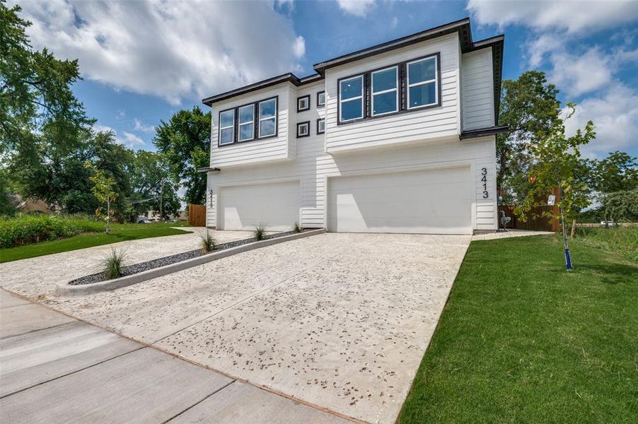 View of front of home featuring a garage, concrete driveway, and a front yard View of front of home featuring a garage, concrete driveway, and a front yard