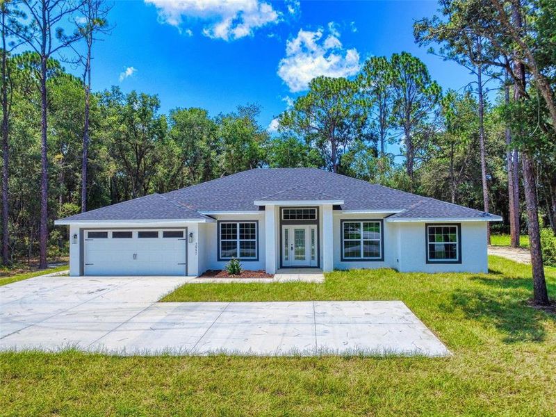 Front exterior of a new home in , Inverness, FL, highlighting curb appeal (Image 34).