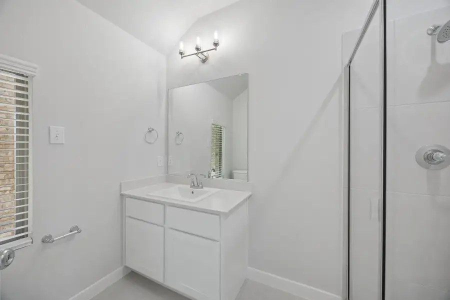 Bathroom in the Masters home plan by Trophy Signature Homes – REPRESENTATIVE PHOTO