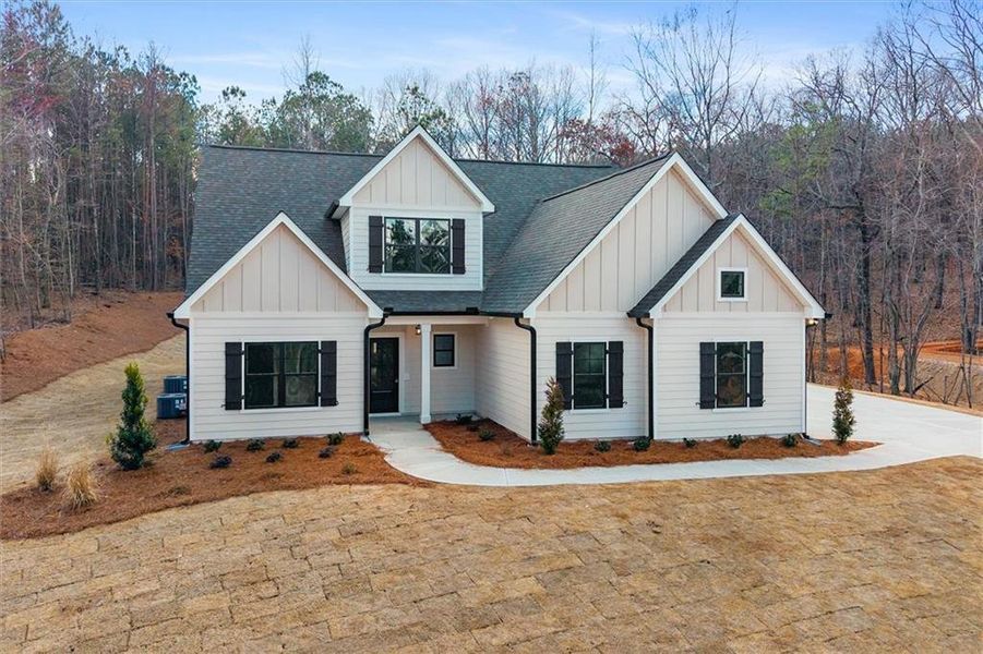 Front exterior of a new home in , Carrollton, GA, highlighting curb appeal (Image 25).