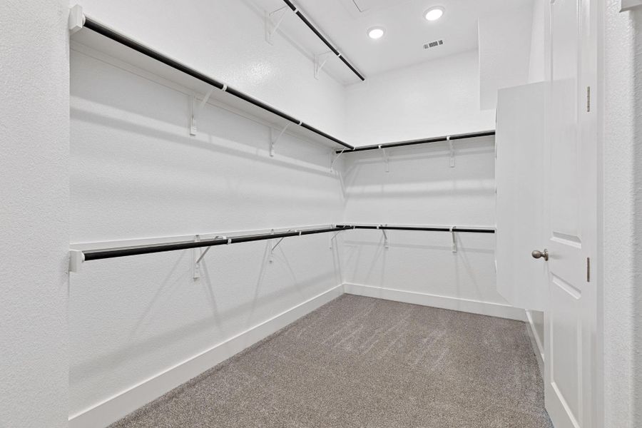 Walk-in closet in Primary Bedroom Walk-in closet in Primary Bedroom