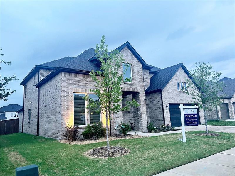 Front exterior of a new home in Northlake Estates 65s, Little Elm, TX, highlighting curb appeal (Image 23).