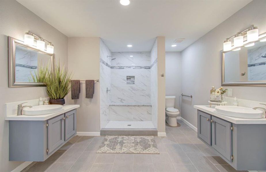 Elegant Hollywood Bath with split dual vanities, with recessed LED lights, very nice.