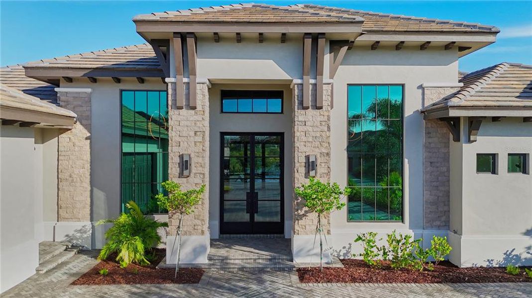 Front exterior of a new home in , Bradenton, FL, highlighting curb appeal (Image 2).