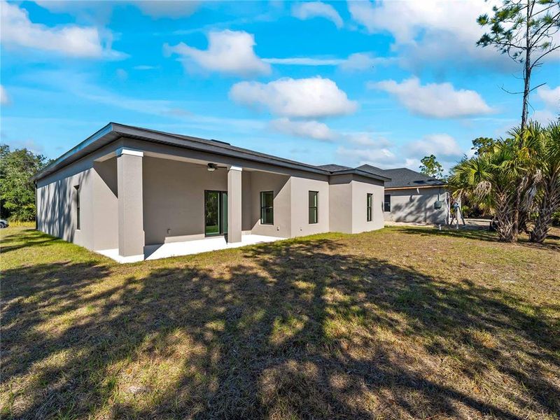 Exterior details and patio area of a home in , North Port (Image 29).