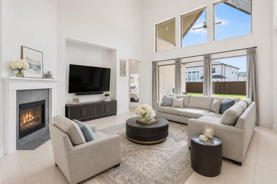 Your spacious living area featuring large windows and high ceilings, perfect for entertaining and hosting guests. -Photo has been virtually altered to help viewer with perspective