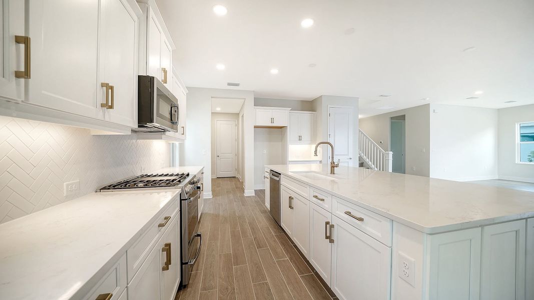 Furnished interior view inside a new home in Palm Grove Real Estate and Homes for Sale in Lakewood Ranch, FL - Neal Communities, Bradenton (Image 3).
