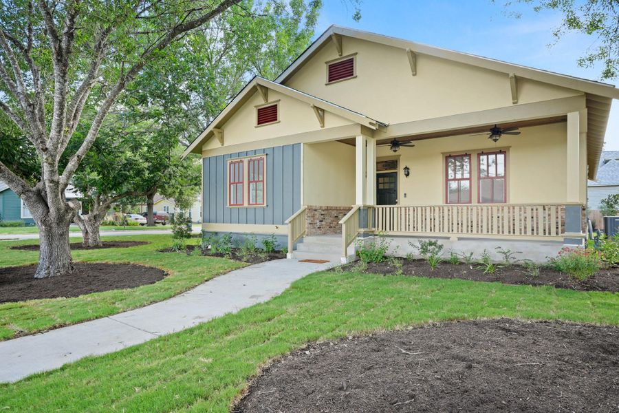 A welcoming front porch with ceiling fans offers a perfect spot for relaxation, enhancing this charming home's curb appeal. A welcoming front porch with ceiling fans offers a perfect spot for relaxation, enhancing this charming home's curb appeal.
