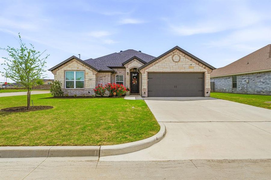 Front exterior of a new home in , Tolar, TX, highlighting curb appeal (Image 21). Front exterior of a new home in , Tolar, TX, highlighting curb appeal (Image 21).