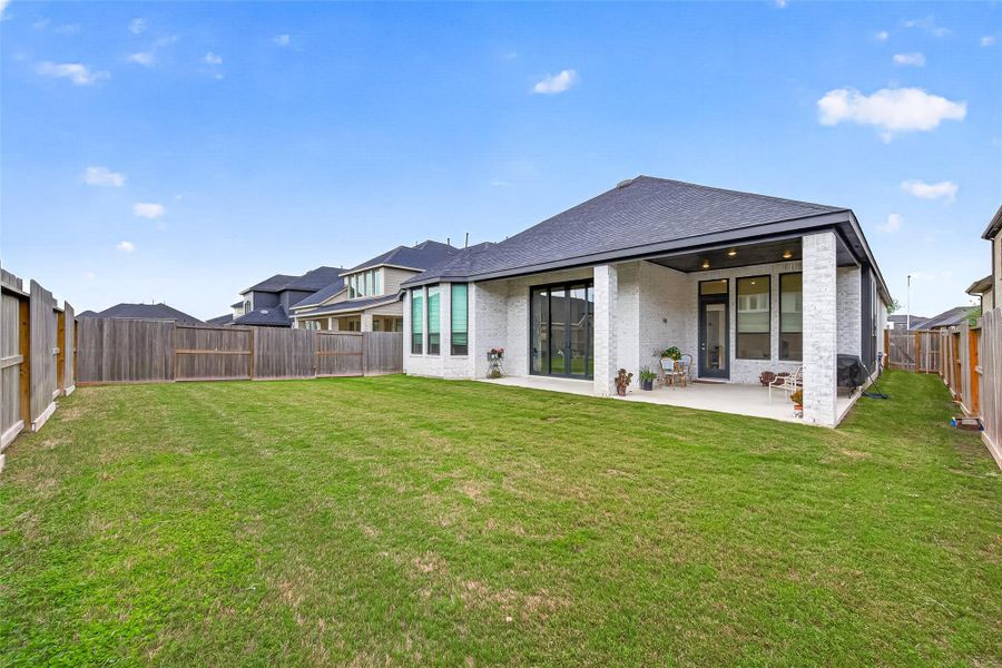 Exterior details and patio area of a home in , Fulshear (Image 27).