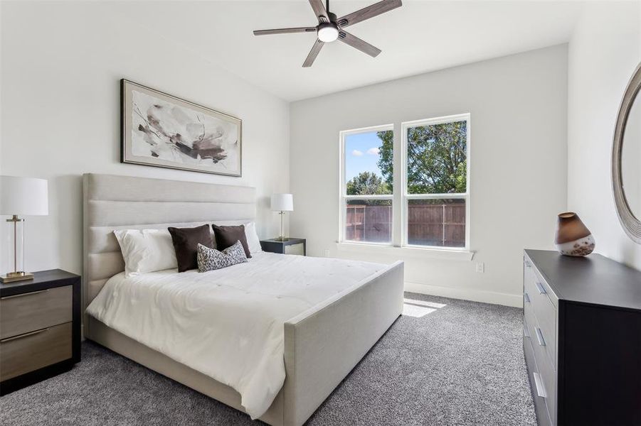 Bedroom with carpet floors and ceiling fan