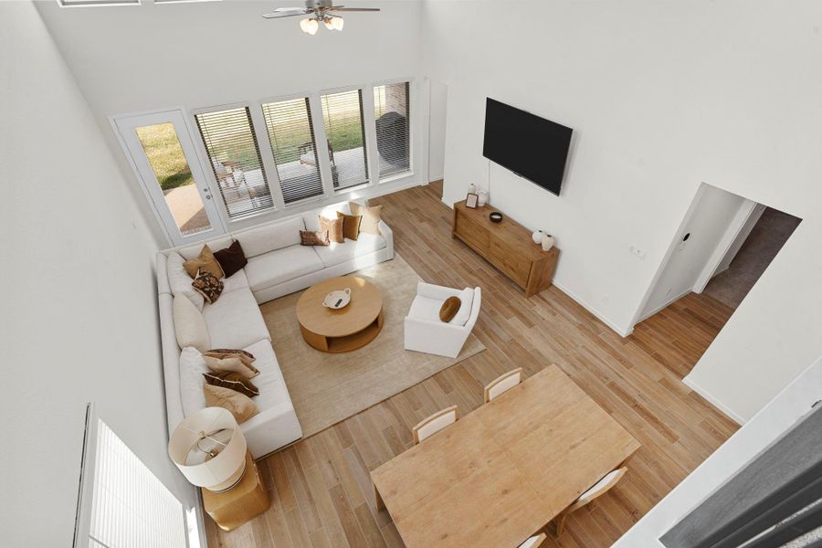 View from above looking down at the seamless integration of the dining and living spaces, perfect for entertaining. View from above looking down at the seamless integration of the dining and living spaces, perfect for entertaining.