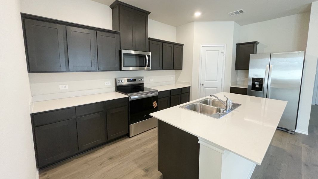 Representative furnished interior of a home built from the Peterson by D.R. Horton in Sweetwater Springs, Sherman (Image 5).