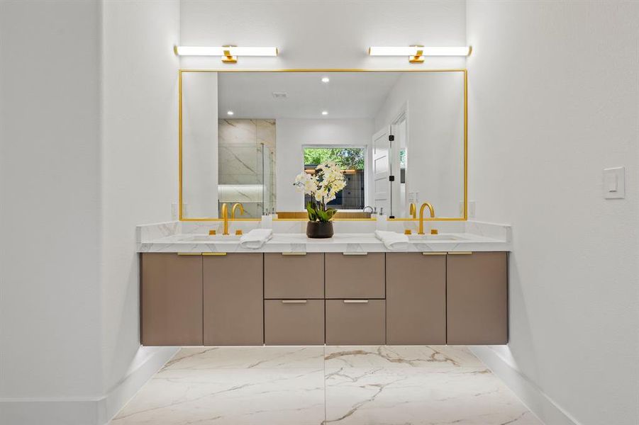 Bathroom featuring tile patterned flooring and double sink vanity