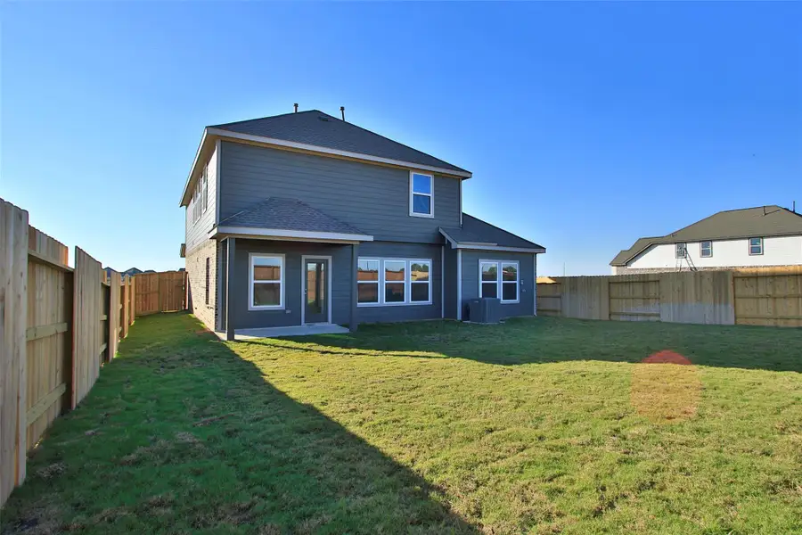 Exterior details and patio area of a home in Oakwood Estates, Waller (Image 2).