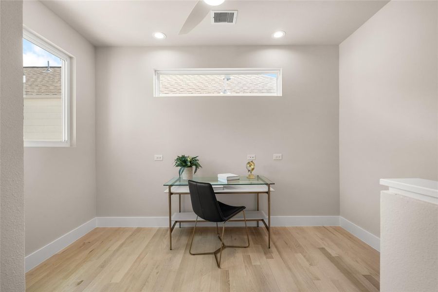 Bright & versatile office nook filled with natural light. Ideal for working from home, studying, or creating a cozy reading corner.