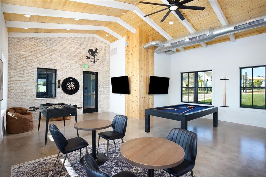 Game room with high vaulted ceiling, a ceiling fan, concrete floors, and pool table