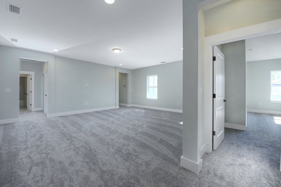 Representative unfurnished interior of a home built from the Julington by Riverside Homes in Hidden Creek at SilverLeaf 70' Series, St. Augustine (Image 37).
