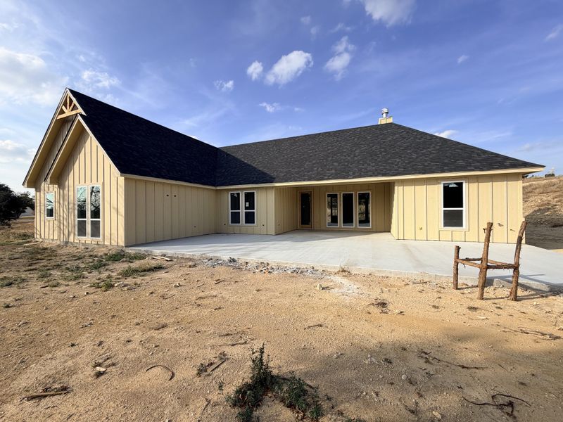 Front exterior of a new home in Saddle Crest Estates, Weatherford, TX, highlighting curb appeal (Image 5).
