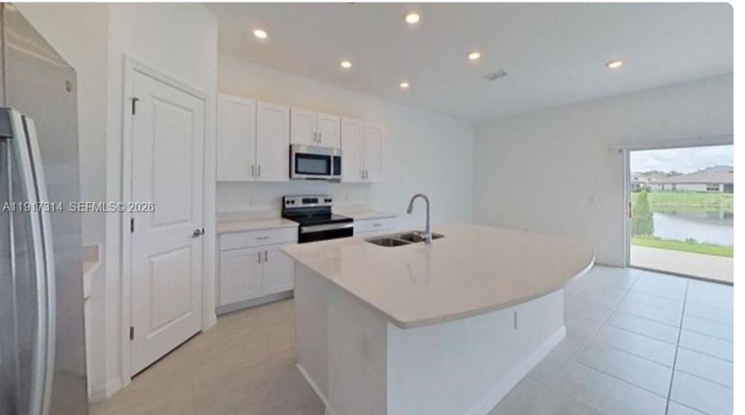 Furnished interior view inside a new home in The Townhomes at Bellalago, Kissimmee (Image 3).