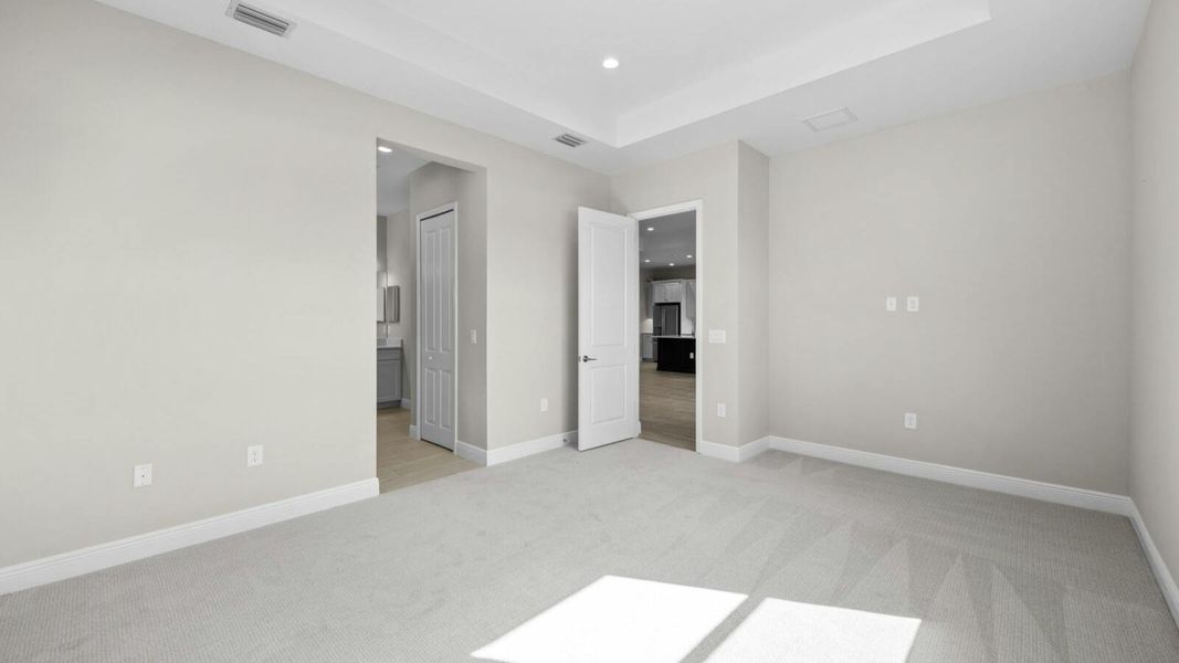 Spacious, unfurnished interior of a new home in SkySail Real Estate and Homes for Sale in Naples, FL - Neal Communities, Naples (Image 11).