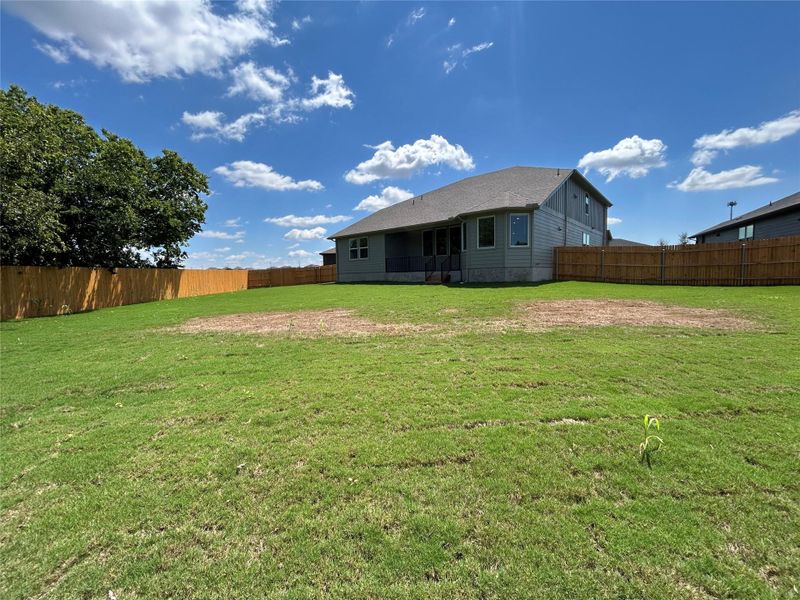 Rear view of property with a fenced backyard and a patio Rear view of property with a fenced backyard and a patio