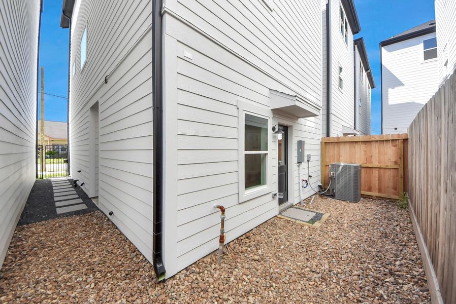 Exterior details and patio area of a home in Skyline Homes at Cavalcade, Houston (Image 4). Exterior details and patio area of a home in Skyline Homes at Cavalcade, Houston (Image 4).