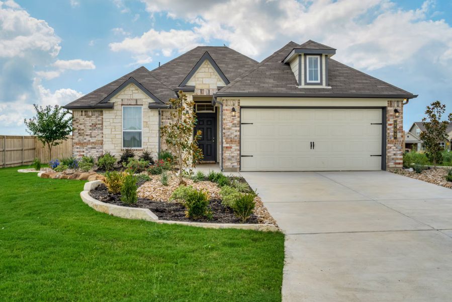 Front exterior of a new home in Eastern Wells, Jarrell, TX, highlighting curb appeal (Image 1).