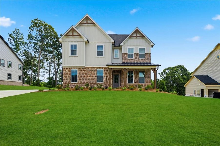 Front exterior of a new home in Acacia, Cumming, GA, highlighting curb appeal (Image 22). Front exterior of a new home in Acacia, Cumming, GA, highlighting curb appeal (Image 22).