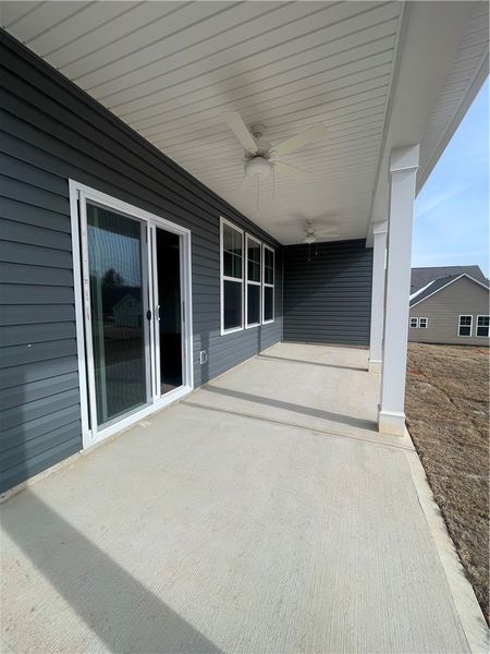 Exterior details and patio area of a home in Springwood Grove, Central (Image 3).