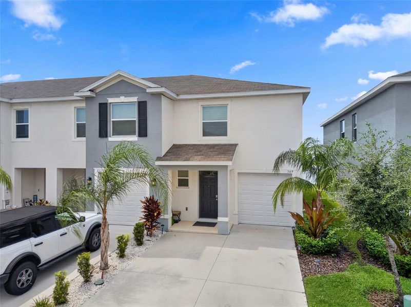 Front exterior of a new home in , Apollo Beach, FL, highlighting curb appeal (Image 27).