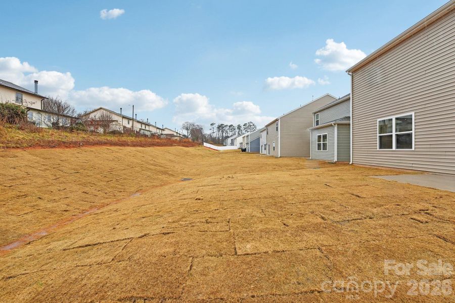 Exterior details and patio area of a home in The Hamptons at Hickory, Hickory (Image 4).