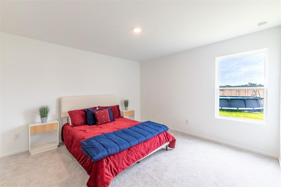 The spacious primary suite features large windows, a walk-in closet, and a private en suite bathroom designed for comfort and convenience. The spacious primary suite features large windows, a walk-in closet, and a private en suite bathroom designed for comfort and convenience.