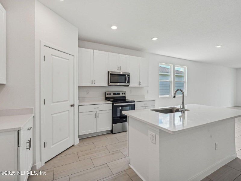 Furnished interior view inside a new home in Lakes at Bella Lago - Signature Series, Green Cove Springs (Image 9).