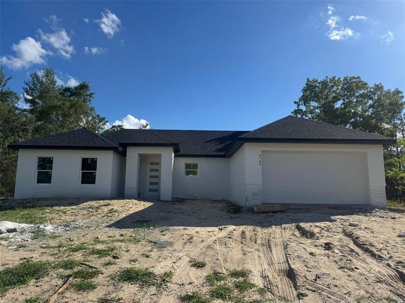 Front exterior of a new home in , Ocala, FL, highlighting curb appeal (Image 18).