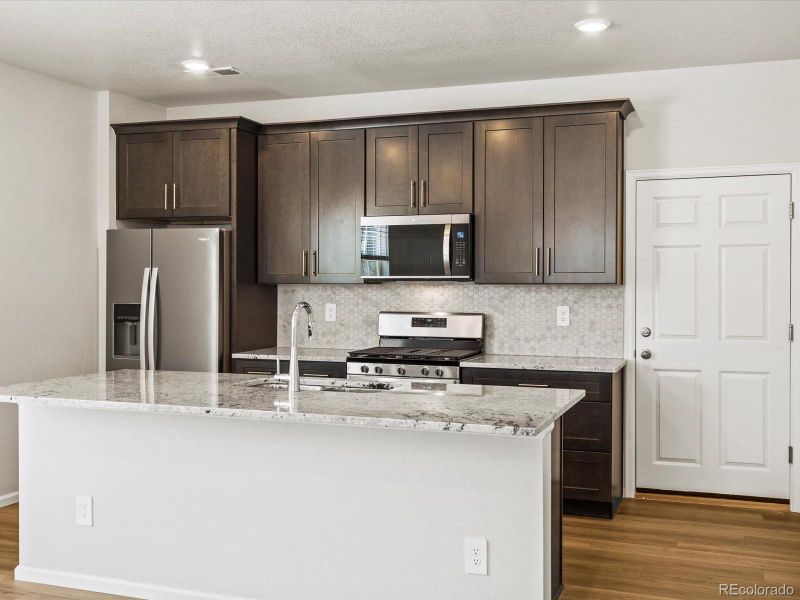 Furnished interior view inside a new home in Skyview at High Point, Aurora (Image 4).