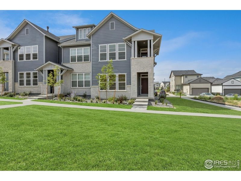 Front exterior of a new home in , Loveland, CO, highlighting curb appeal (Image 23).