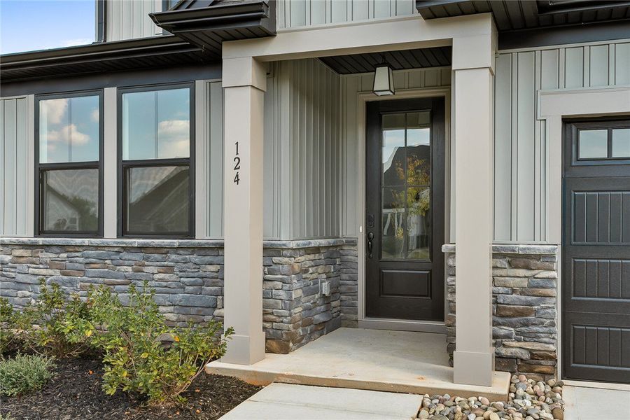 A welcoming front porch features clean architectur