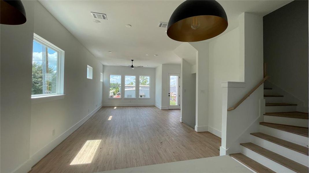 Open-concept living and dining space with ample natural light.