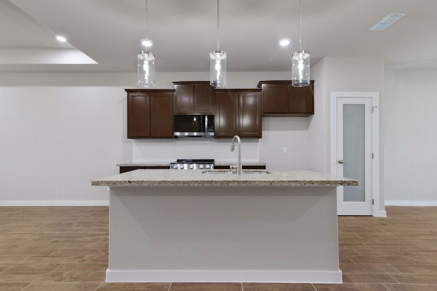 Representative furnished interior of a home built from the Clovis by Hakes Brothers in Monte Cielo, Weslaco (Image 7).